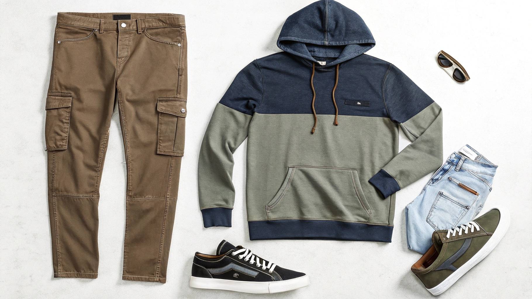 Hoodie layered with both skinny jeans for a sleek look and cargo pants for a rugged style, showcasing the hoodie’s versatility in casual, street-ready fashion.